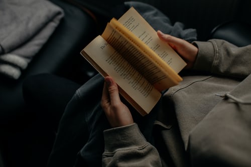 Person reads a book.