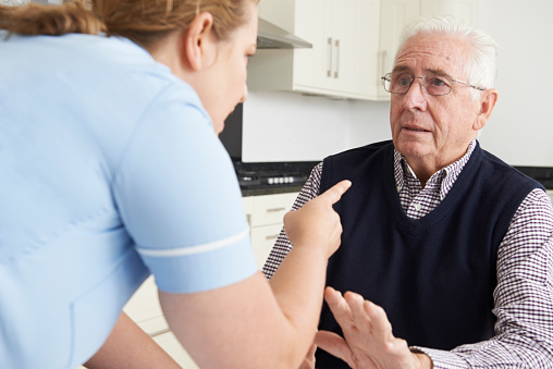 Care Worker Mistreating Elderly Man